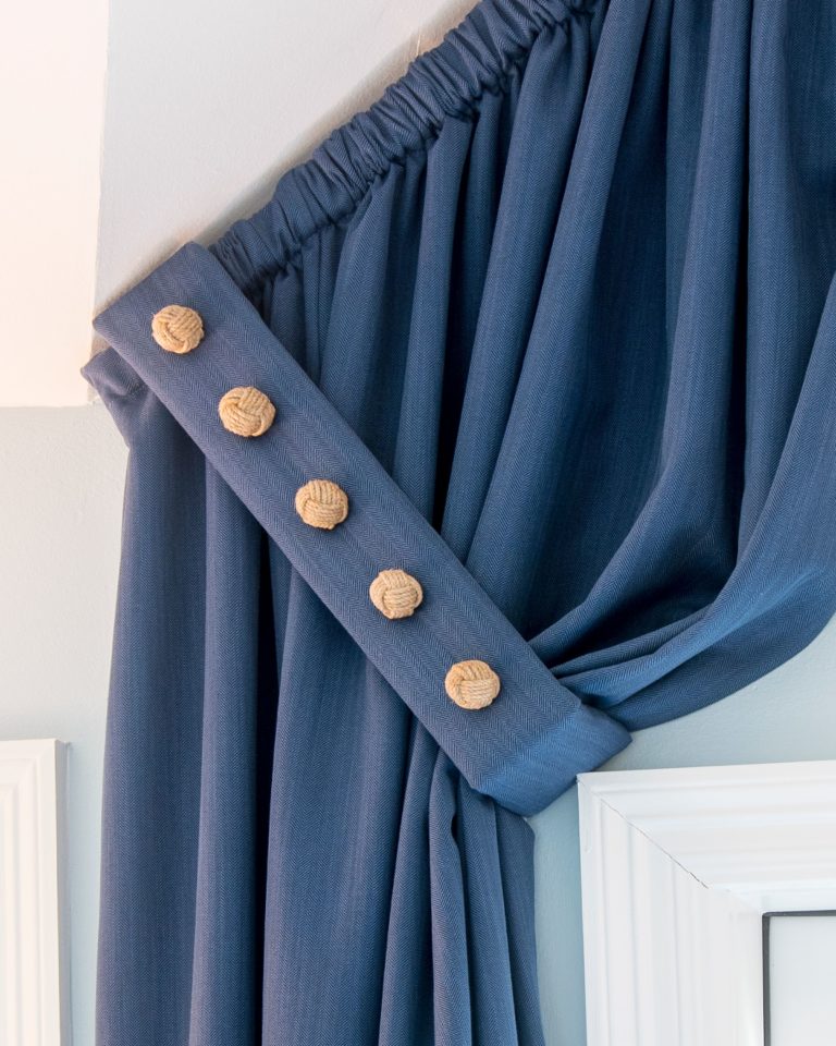 Window Treatment with Upholstered Buttons on Tiebacks