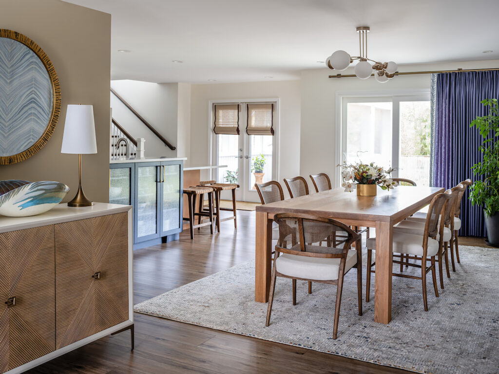 Neutral dining room with statement window treatments
